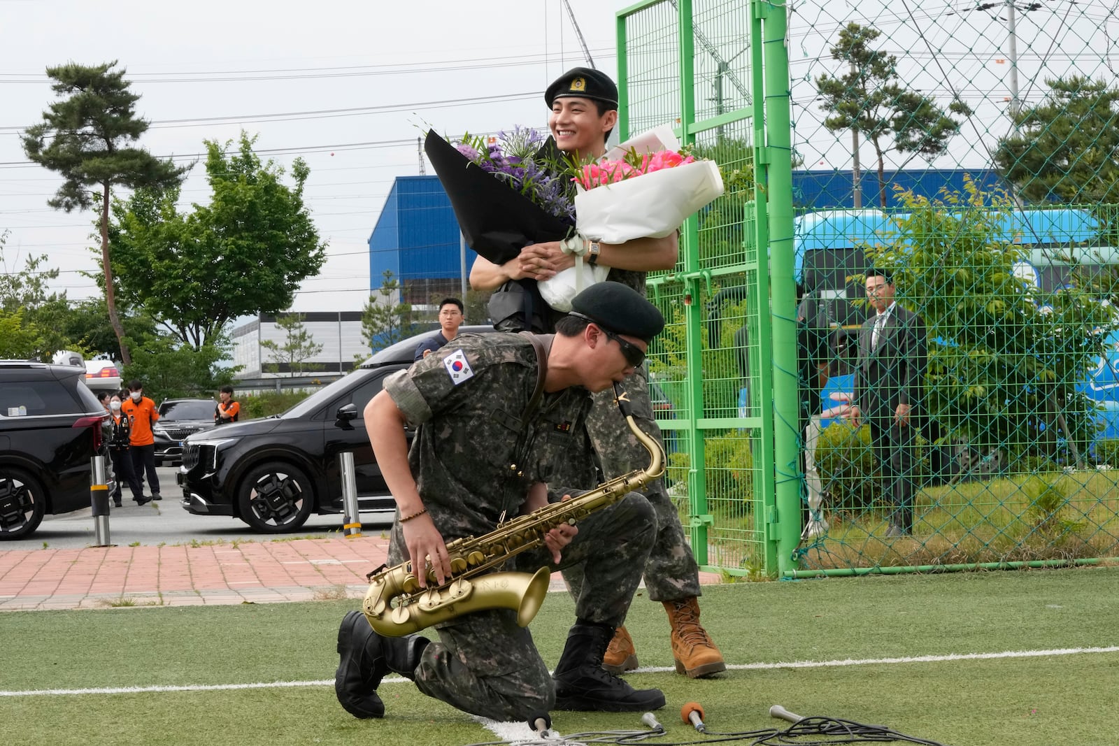 FILE - K-pop band BTS members RM, bottom, and V react after being discharged from a mandatory military service in Chuncheon, South Korea, Tuesday, June 10, 2025. (AP Photo/Ahn Young-joon, File)