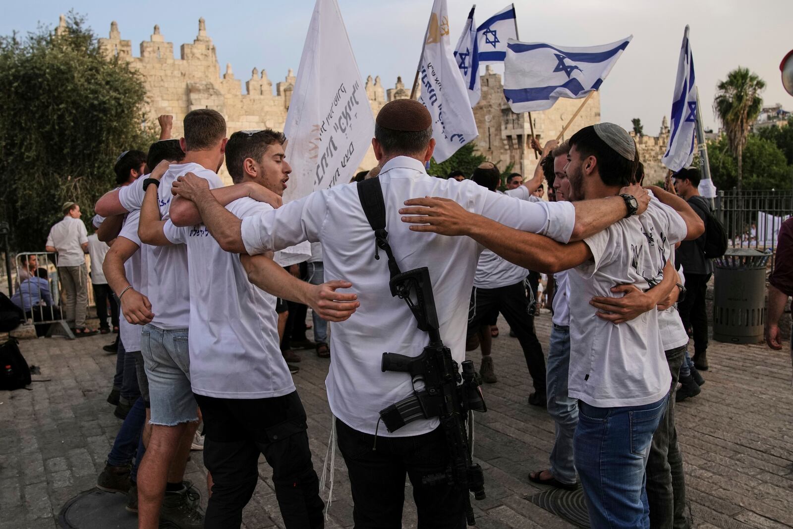 Israelis participate in a march marking Jerusalem Day, an Israeli holiday celebrating the capture of east Jerusalem in the 1967 Mideast war, in Damascus Gate of Jerusalem's Old City, Monday, May 26, 2025. (AP Photo/Leo Correa)
