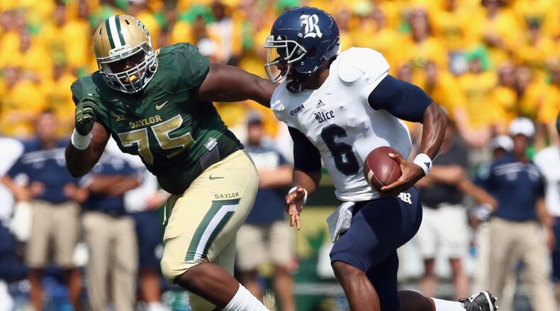 Bengals defensive tackle Andrew Billings, seen here as a Baylor Bear tracking Rice's Driphus Jackson in a 2015 game, missed his rookie season of 2016 with a knee injury.