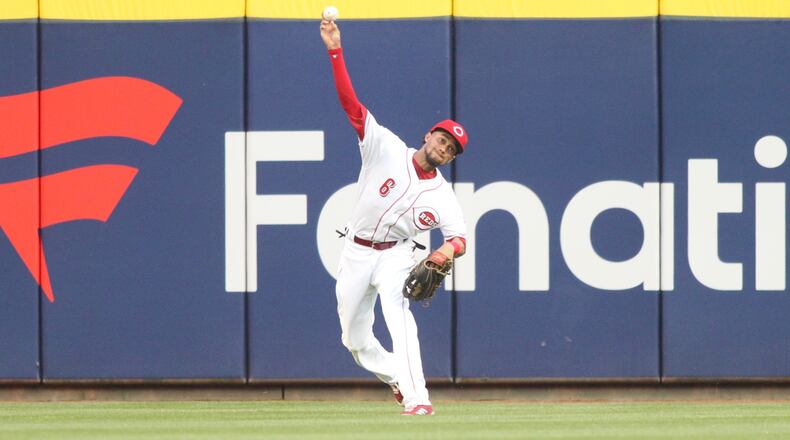 Billy Hamilton throws a ball back to the infield during a game against the New York Mets on May 7, 2018, at Great American Ball Park in Cincinnati.