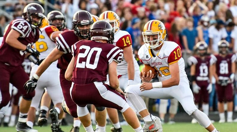 Fenwick quarterback Sully Janeck tries to elude Lebanon’s Ethan Marsh (20) during a Sept. 8 game at James VanDeGrift Stadium in Lebanon. The host Warriors won 49-27. NICK GRAHAM/STAFF