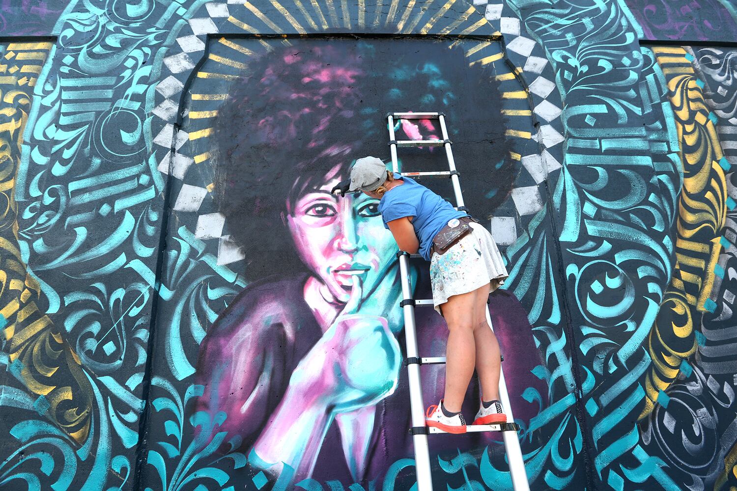 PHOTOS: New Dayton mural created in calligraffiti style with more than 20 colors