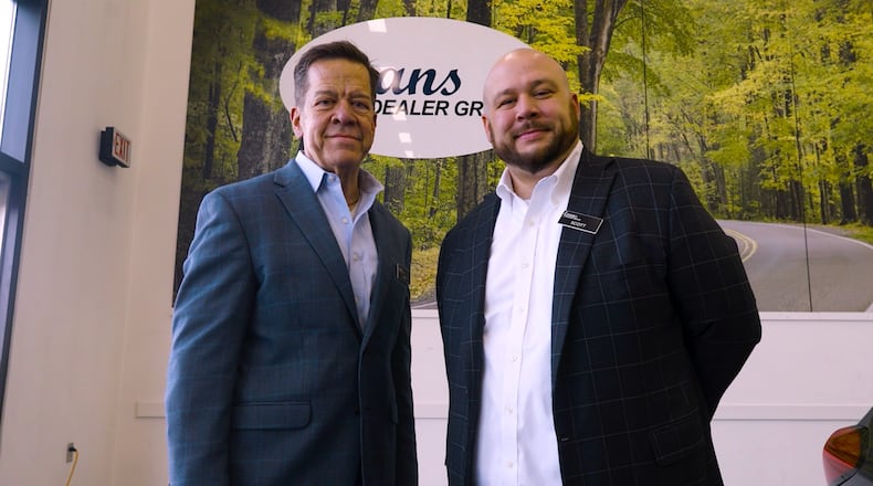Jim Evans, president and owner of Evans Auto Group, with his son, Scott Evans, who oversees the Evans Volkswagen dealership. Contributed.