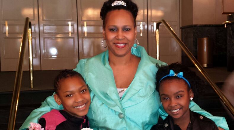 The Rev. Dawn Martin, middle, with two of her mentees from Girls Empowered and Mentored to Success