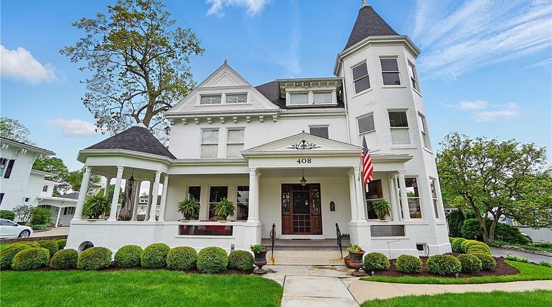 This historical Troy home has three levels and a basement. It features a tower with rooms in all three levels and a full front porch with gazebo.