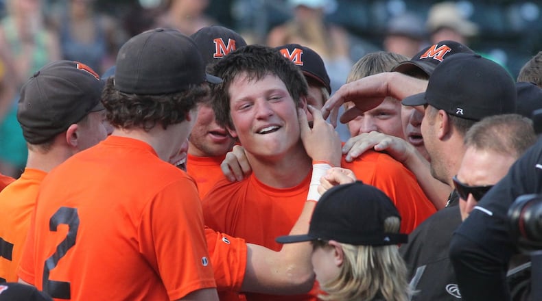 Minster celebrates Jon Niemeyer’s game-winning hit against Russia in the Division IV state championship game on Saturday, June 3, 2017, at Huntington Park in Columbus. David Jablonski/Staff