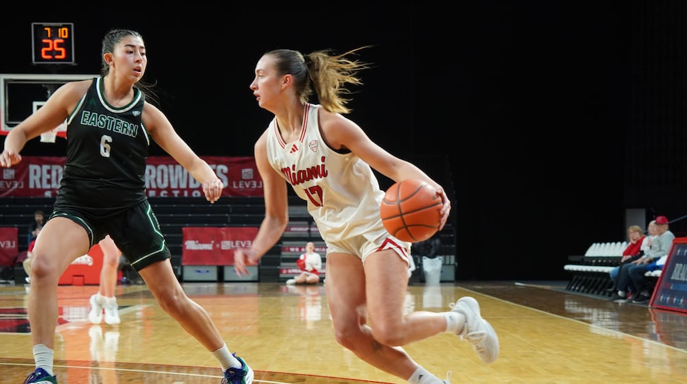 Miami’s Núria Jurjo dribbles into the lane against Eastern Michigan on Wednesday night at Millett Hall. CHRIS VOGT / CONTRIBUTED