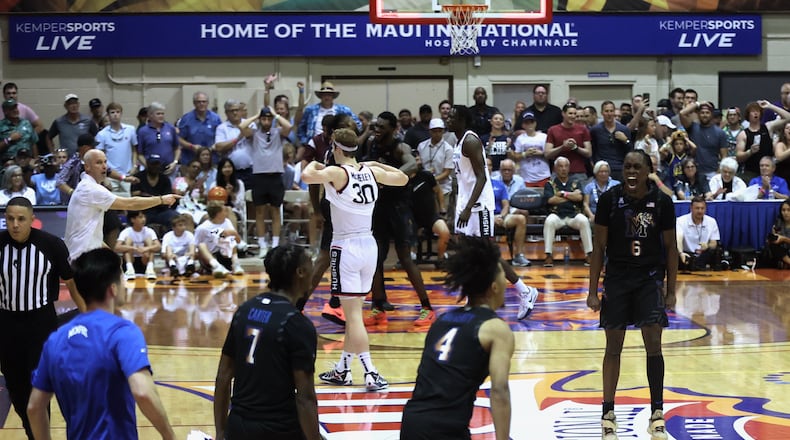 Memphis celebrates a victory against Connecticut in the first round of the Maui Invitational on Monday, Nov. 25, 2024, at the Lahaina Civic Center. David Jablonski/Staff