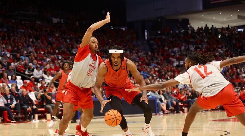 Ohio State's Zed Key, left, guards Dayton's DaRon Holmes II during an exhibition on Sunday, Oct. 22, 2023, at UD Arena. David Jablonski/Staff