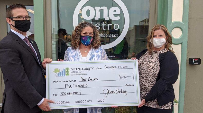 One Bistro accepts a check from the Greene County Community Improvement Corporation. CONTRIBUTED