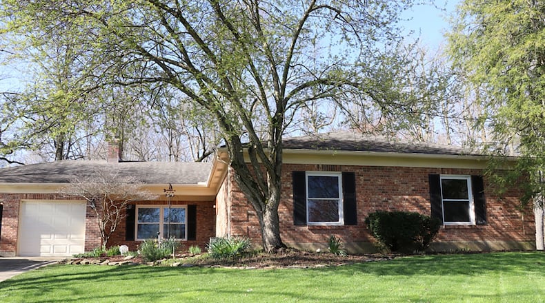 The brick ranch has about 1,765 sq. ft. of living space. The 3-bedroom home sits at the end of a cul-de-sac on a half-acre lot. A concrete driveway leads up to a 2-car garage with workshop area. CONTRIBUTED PHOTOS BY KATHY TYLER