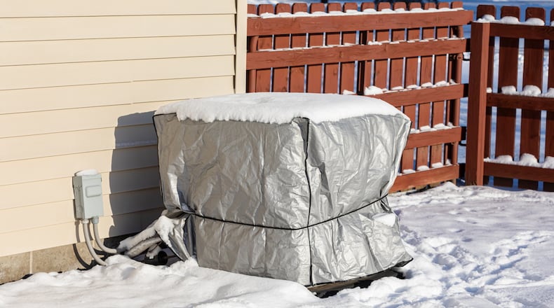 Walk the perimeter of your home and check for anything that might need attention when winterizing, including loose siding, cracked caulking or gaps around vents and foundations. You might also consider covering an outdoor air conditioning unit. ISTOCK