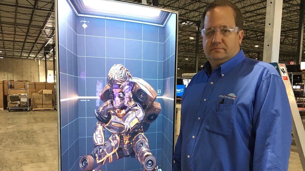 Chris Riegel, founder and CEO of Dayton digital signage company Stratacache, at his company's Trotwood production and distribution site. THOMAS GNAU/STAFF