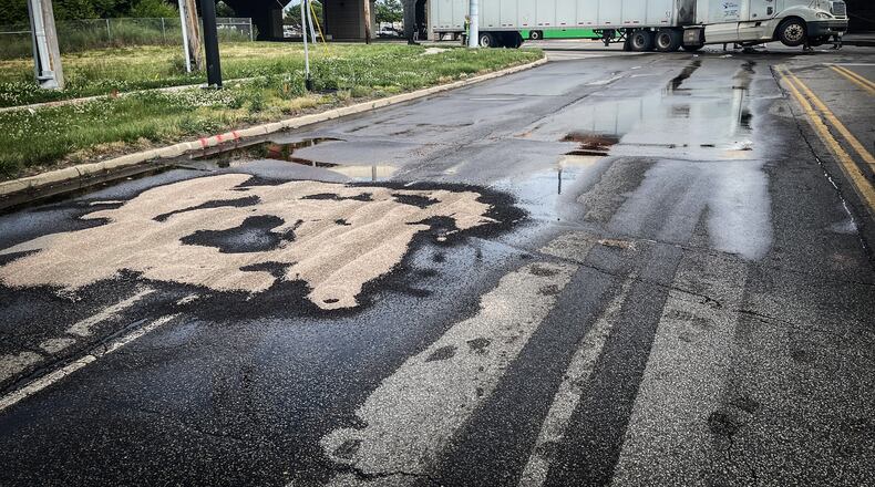 About 50 gallons of diesel fuel spilled out after a vehicle struck the fuel tank of a semitrailer.
