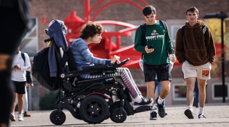 Students at Wright State University walk to and from class at the university Monday October 24, 2022. JIM NOELKER/STAFF