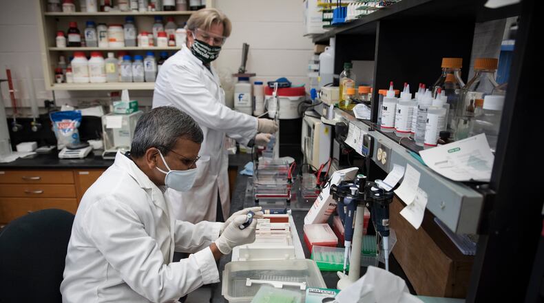 Air Force Research Laboratory scientist and project lead Dr. Saber Hussain (left) and Wright State University Chair of the Department of Pharmacology and Toxicology Dr. Jeffrey Travers collaborate in the new laboratory space established as part of a Cooperative Research and Development Agreement between AFRL and Wright State University. The partnership will help advance research into the identification of stressors that can affect Airmen. (U.S. Air Force Photo/Richard Eldridge).
