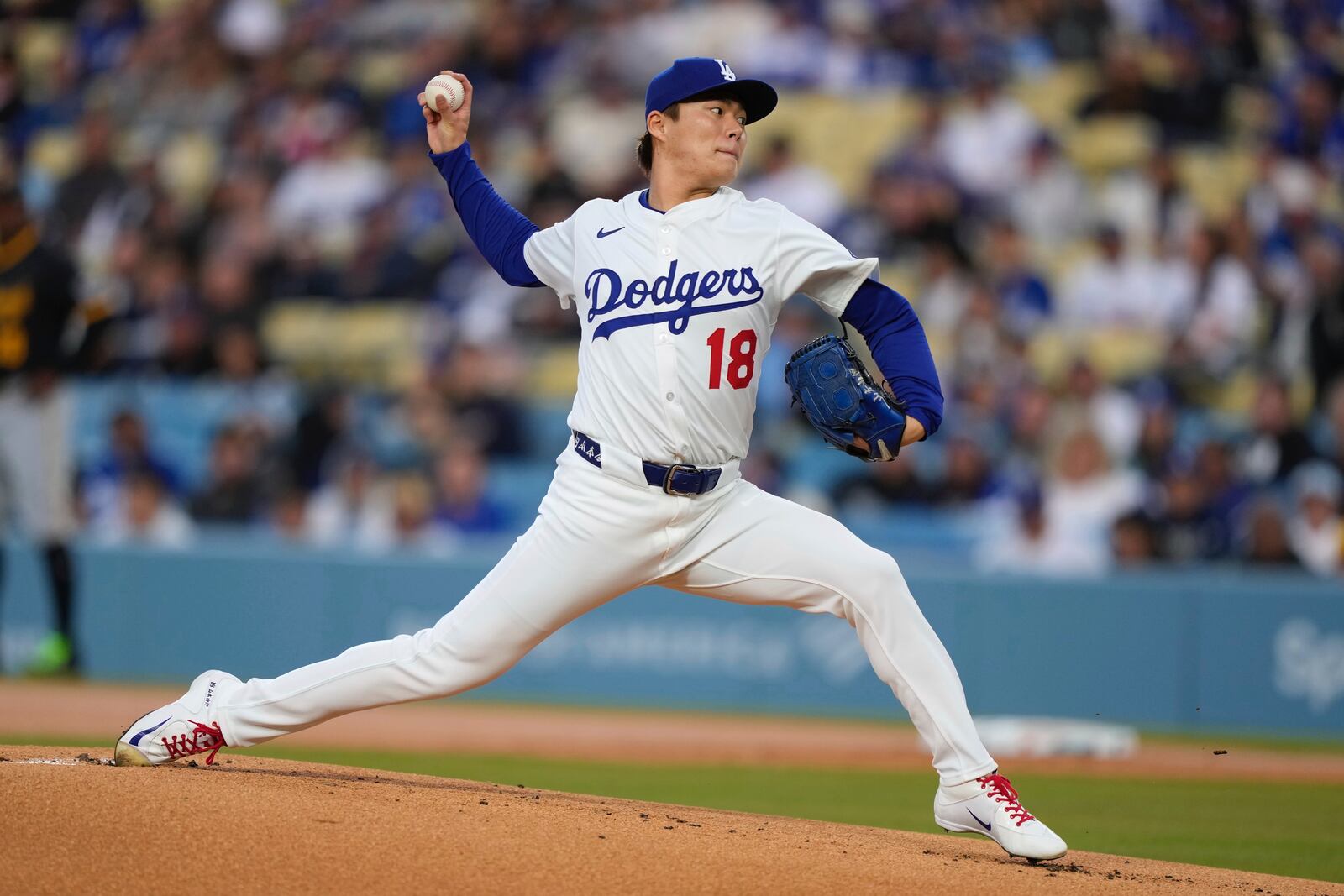 Los Angeles Dodgers starting pitcher Yoshinobu Yamamoto throws to the plate during the first inning of a baseball game against the Pittsburgh Pirates, Friday, April 25, 2025, in Los Angeles. (AP Photo/Mark J. Terrill)
