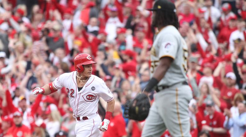 The Reds' Derek Dietrich rounds the bases after a three-run home run against the Pirates on Opening Day on Thursday, March 28, 2019, at Great American Ball Park in Cincinnati.