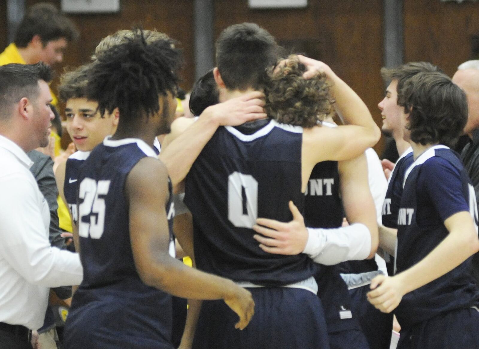 Fairmont celebrates, including Ryan Hall (0) and Kellan Bochenek. Fairmont defeated Wayne 51-43 in a boys high school basketball D-I sectional final at Centerville on Monday, March 4, 2019. MARC PENDLETON / STAFF