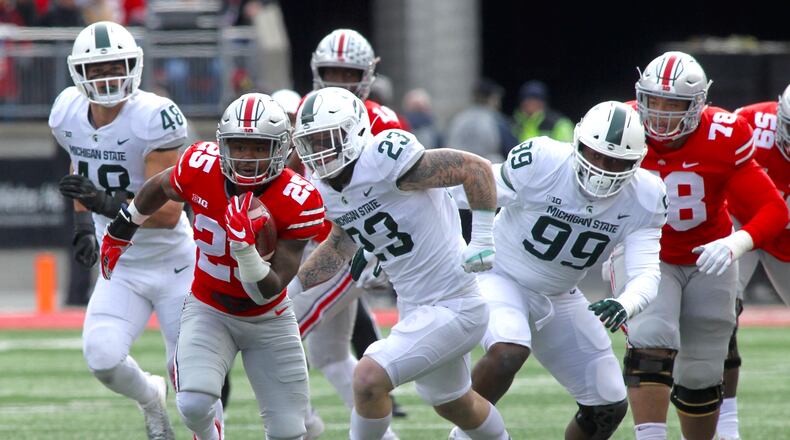 Ohio States Mike Weber runs for a touchdown against Michigan State on Saturday, Nov. 11, 2017, at Ohio Stadium in Columbus. David Jablonski/Staff