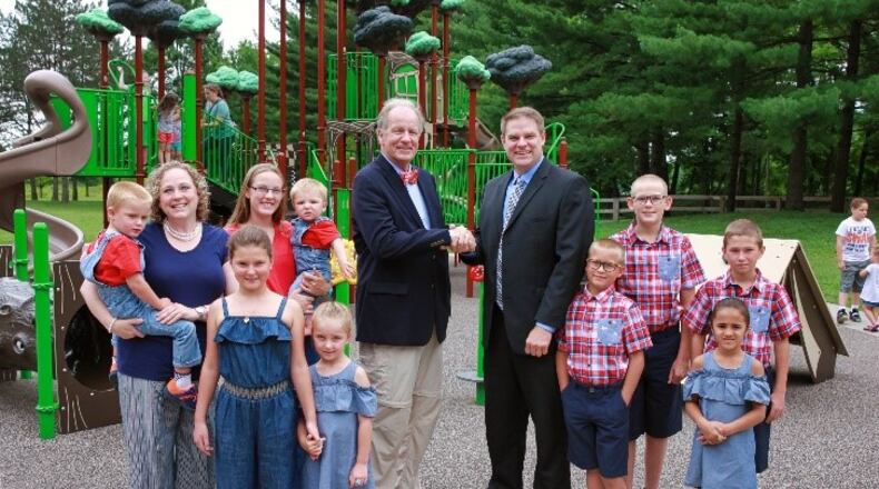 Judge Randy Rogers (left) congratulates Daryl Nelson (right) after swearing in Nelson as MetroParks of Butler County’s newest board member.