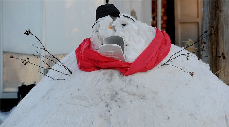 This giant snowman looks hungry for the mail along Dayton-Springfield Road in Enon, Feb. 17, 2021. MARSHALL GORBY\STAFF