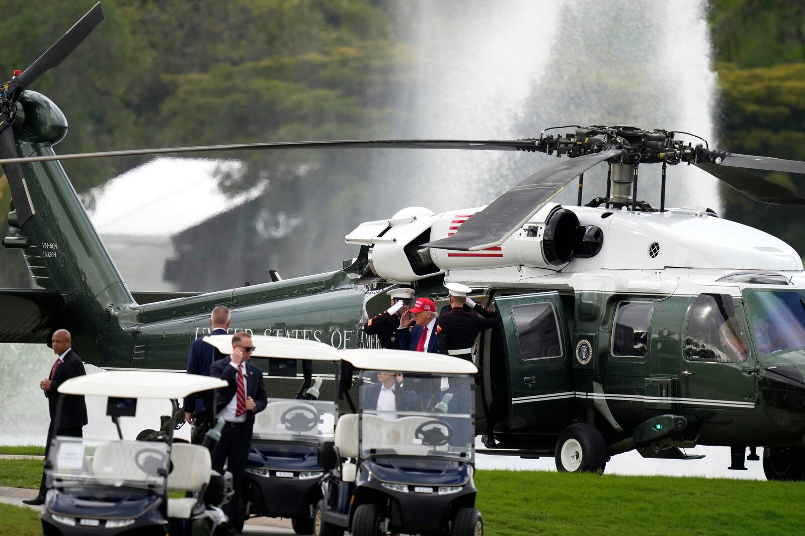 President Donald Trump steps off Marine One as he arrives at Trump National Doral during the LIV Golf Miami tournament, Thursday, April 3, 2025, in Miami. (AP Photo/Alex Brandon)