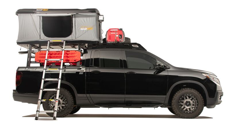 MIDSIZE PICKUP: 2019 HONDA RIDGELINEThe Honda Ridgeline has some neat tricks that make it an ideal campsite companion. For instance, the cargo bed has a lockable underfloor trunk that can be used for storing gear or even ice and drinks and a drain plug lets you to get rid of the water when you’re done. There’s even a dealer-accessory tent that Honda will sell you. It’s perfectly sized for the bed and allows for a full-size mattress and off-the-ground sleeping. The Ridgeline is also roomy and comfortable, which helps during those long trips to the campsite.Ridgeline RTL-T AWD starting MSRP: $39,945Honda Off-Pavement Adventure Portfolio at 2019 Overland Expo West photo