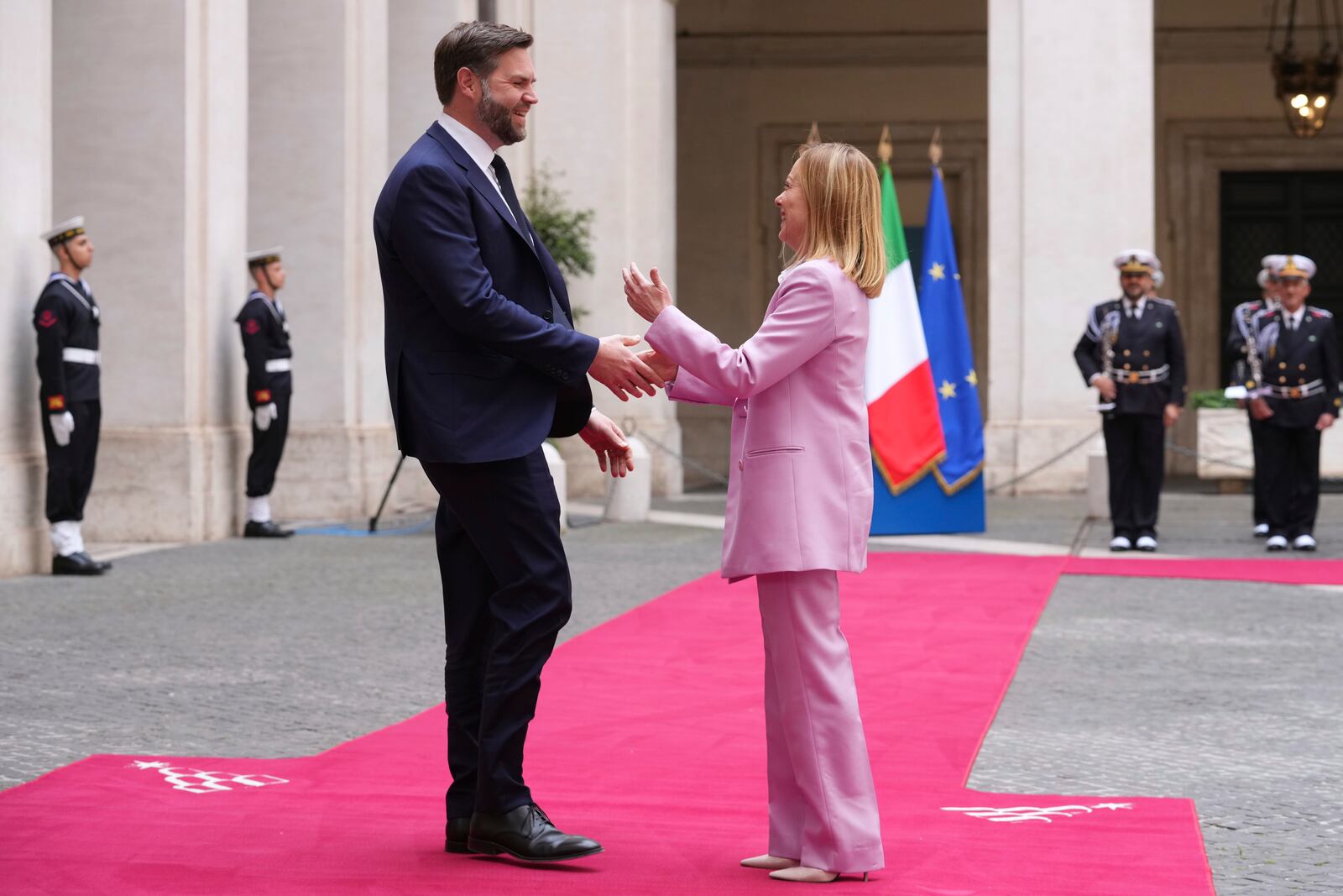 U.S. Vice President JD Vance, left, is welcomed by Italian Premier Giorgia Meloni as he arrives for talks at Palazzo Chigi government office in Rome, Friday, April 18, 2025. (AP Photo/Andrew Medichini)