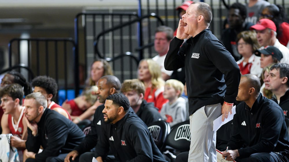 Miami (Ohio) head coach Travis Steele talks to his team during the first half of an NCAA college basketball game against Ohio, Friday, March 6, 2026, in Athens, Ohio. (AP Photo/HG Biggs)