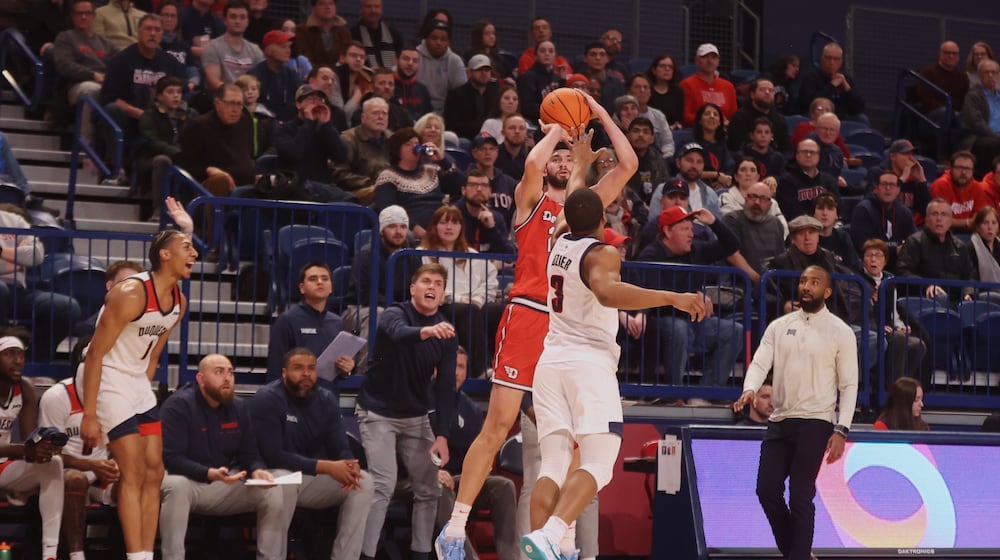 Dayton's Jacob Conner makes a 3-pointer in the first half against Duquesne on Tuesday, Jan. 21, 2025, at the UPMC Cooper Fieldhouse in Pittsburgh. David Jablonski/Staff