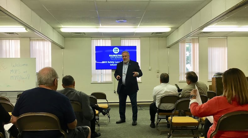 Hamilton Schools Superintendent Larry Knapp makes a presentation on a proposed security tax during a public town hall meeting Tuesday evening to a small gathering at First Baptist Church in Hamilton. The public meeting, which was designed to build support for a 1.5-mill security tax for the city schools, was one of three planned before voters decide on the tax hike in November.