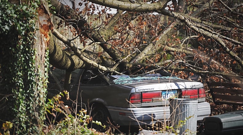 A Large tree branch crushed a car on Dayton Road near Enon Sunday. Due to High winds and severe weather. MARSHALL GORBY\STAFF