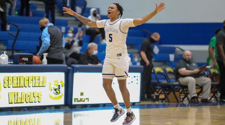 Springfield High School senior Josh Tolliver celebrates after beating Northmont 68-67 on Friday night at Springfield High School. Tolliver scored 26 points, including the game-winning basket with 4.2 seconds remaining. CONTRIBUTED PHOTO BY MICHAEL COOPER