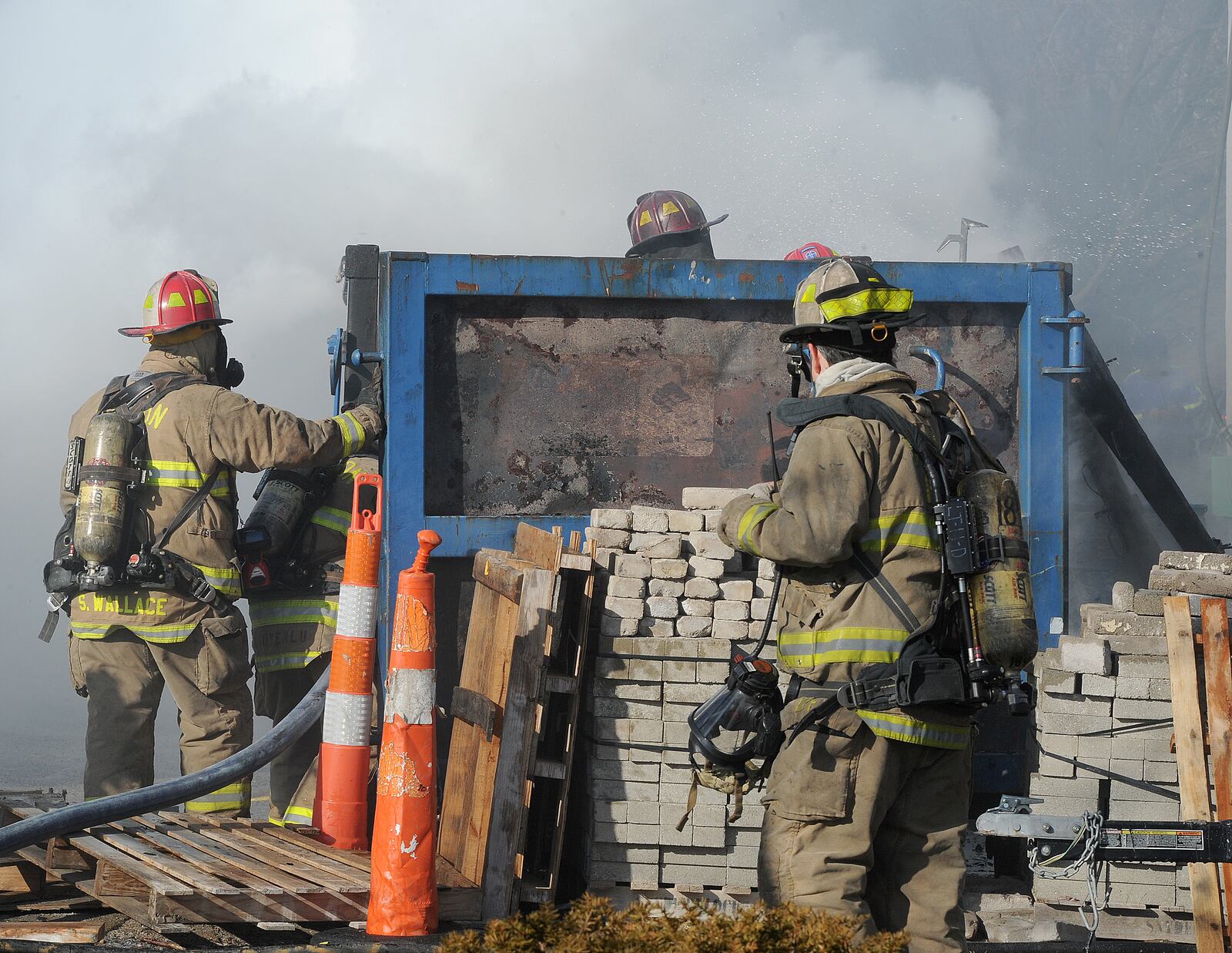 Dayton Firefighters responded to a two-alarm fire near Ludlow Street and Fifth Street in downtown Dayton. Officials said that no one was injured in the blaze and the building, which is being renovated, also was not damaged. Officials believe discarded smoking material in a dumpster started the fire.  MARSHALL GORBY\STAFF