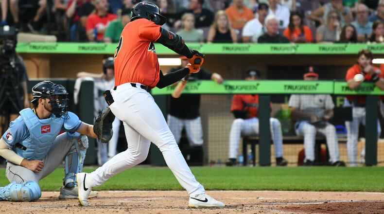 Ariel Almonte singles in the fifth inning Friday night at Day Air Ballpark. The Dragons loaded the bases for the second time and failed to score again. JEFF GILBERT/CONTRIBUTED
