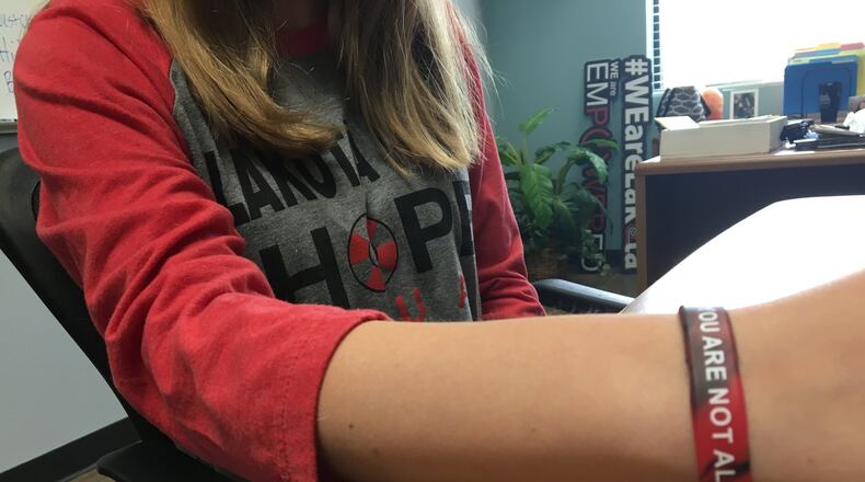 A student at Lakota West High School shows off her Hope Squad gear. KATIE WEDELL/STAFF
