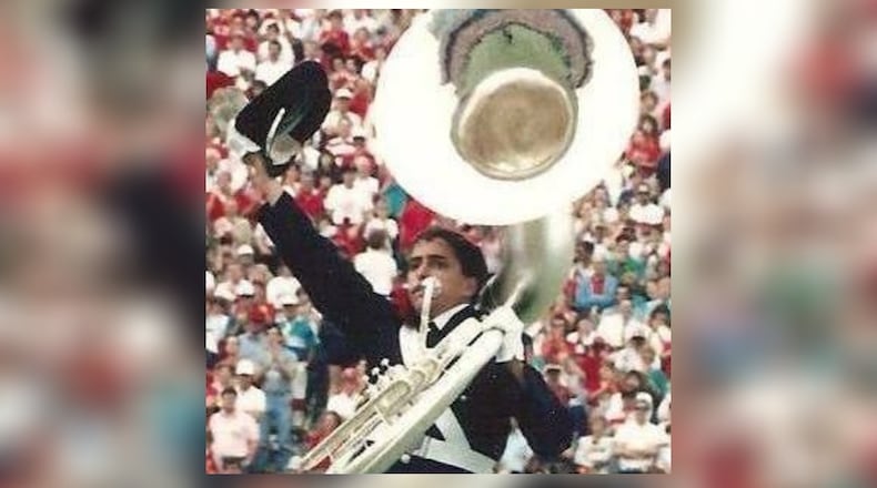 Miamisburg resident Darren Montgomery dotted the “i” in Script Ohio in 1988 as an Ohio State University sousaphone player. CONTRIBUTED