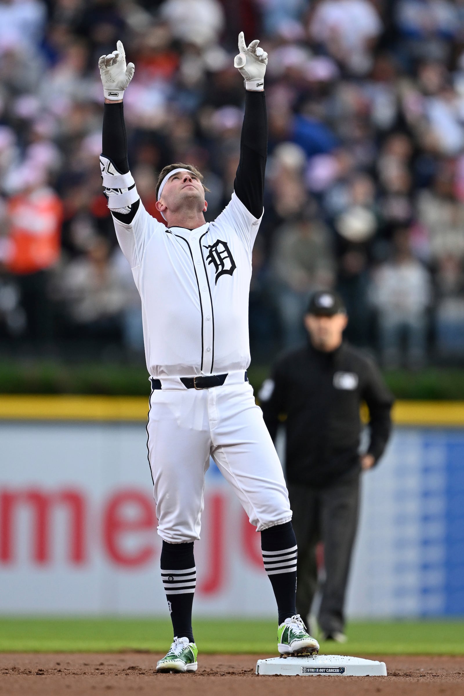 Detroit Tigers Kerry Carpenter (30) celebrates at second base after hitting a lead off double against the Cleveland Guardians in the first inning during a baseball game, Saturday, May 24, 2025, in Detroit. (AP Photo/Lon Horwedel)