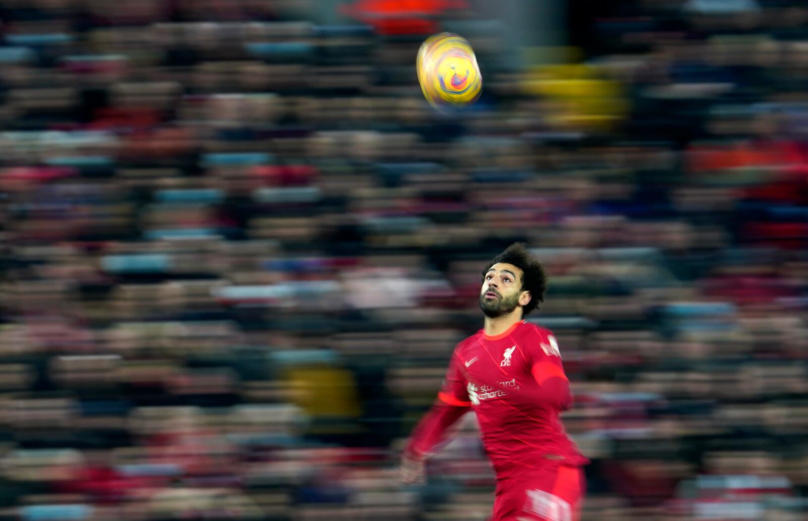 FILE - Liverpool's Mohamed Salah controls the ball during the English Premier League soccer match between Liverpool and Newcastle United at Anfield stadium in Liverpool, England, on Dec. 16, 2021. (AP Photo/Jon Super, File)