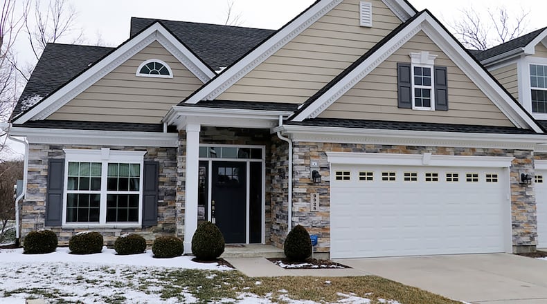 The 3-bedroom, stone-and-plank patio home has about 2,010 sq. ft. of living space. The unit is one of a 2-unit building located on a cul-de-sac within the Highlands of Yankee Trace. The condominium is tucked back off the course along a tree-line property with no rear neighbors. CONTRIBUTED PHOTO BY KATHY TYLER