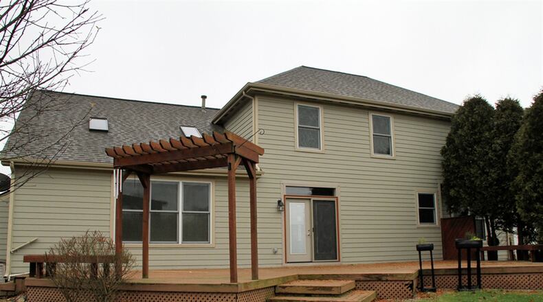 The great room has a vaulted ceiling with skylights and a loft family room above. The basement has been finished to include a recreation room, a possible exercise room and a full bathroom.