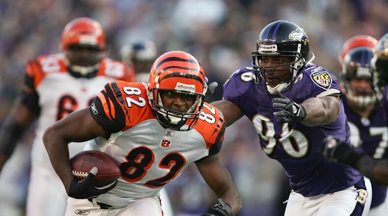 BALTIMORE - NOVEMBER 5: Reggie Kelly #82 of the Cincinnati Bengals runs for yardage past Adalius Thomas #96 of the Baltimore Ravens during their game at M&T Bank Stadium on November 5, 2006 in Baltimore, Maryland. The Ravens defeated the Bengals 26-20. (Photo by Harry How/Getty Images)
