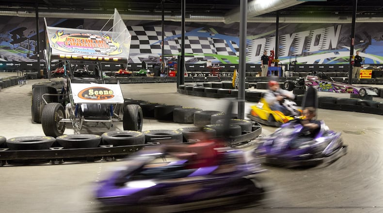 Electric go-carts zip around the track at Scene75, a perfect destination for indoor family fun. TY GREENLEES/STAFF
