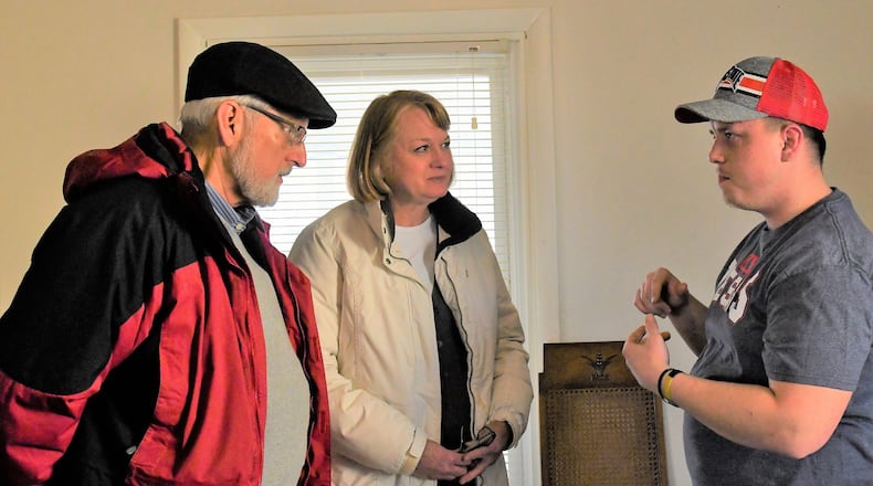 Reed and Donna Sevitts talk with Matthew Ruemping (right), case manager for the Troy Joshua Recovery Ministries. CONTRIBUTED