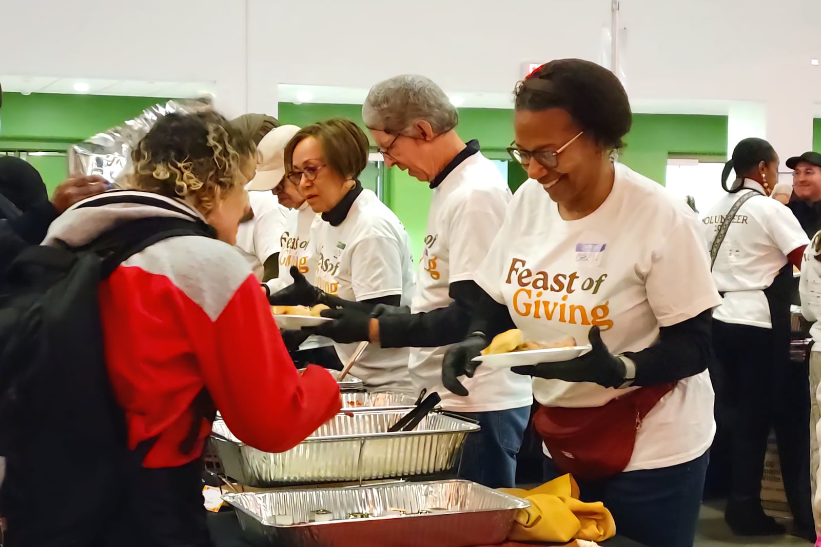 About 300 volunteers helped make and serve food at the 2025 Dayton Feast of Giving on Thanksgiving Day, November 27, 2025. LONDON BISHOP/STAFF