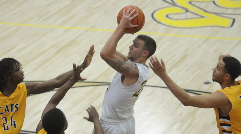 Centerville’s Keegan Saben (with ball) draws three Springfield defenders. Centerville lost 46-40 to visiting Springfield in a boys high school basketball game on Tuesday, Jan. 10, 2017. MARC PENDLETON / STAFF