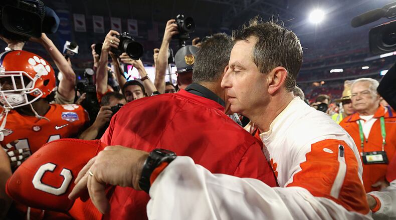 GLENDALE, AZ - DECEMBER 31: Head coach Dabo Swinney of the Clemson Tigers greets head coach Urban Meyer of the Ohio State Buckeyes after the Clemson Tigers defeated the Ohio State Buckeyes 31-0 to win the 2016 PlayStation Fiesta Bowl at University of Phoenix Stadium on December 31, 2016 in Glendale, Arizona. (Photo by Christian Petersen/Getty Images)