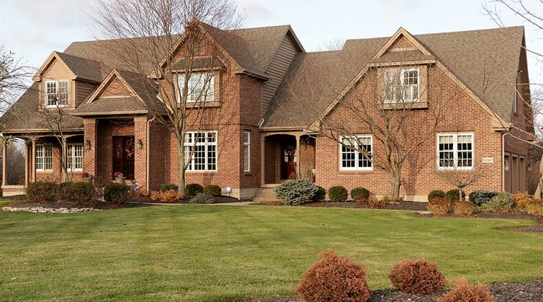 The 5-bedroom brick house has about 4,980 sq. ft. of living space. Set on a 1.88-acre property within the Hampton Farms subdivision of Washington Twp., the home has a tree-lined back yard and a 3-car side-entry garage. CONTRIBUTED PHOTO BY KATHY TYLER