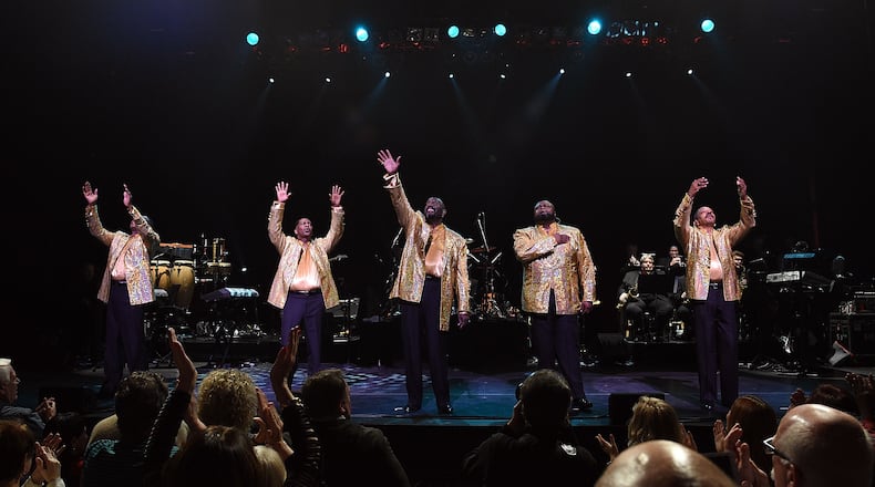 NEW YORK, NY - DECEMBER 29:  (L-R) Members of The Temptations, Joe Herndon, Terry Weeks, Otis Williams, Bruce Williamson and Ronald Tyson take their curtain call bow at "The Temptations and The Four Tops on Broadway" at Palace Theatre on December 29, 2014 in New York City.  (Photo by Andrew H. Walker/Getty Images)